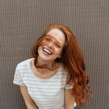 Happy young woman laughing happily