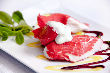 A plate of meat on a white background