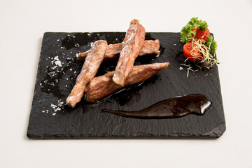 Iberian secret dish on a white background