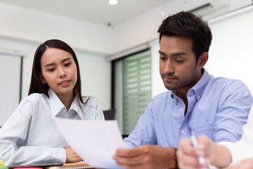 Asian business man and women meeting and talk about job in office.