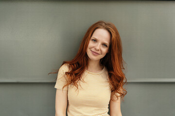 Friendly young woman looking intently at camera