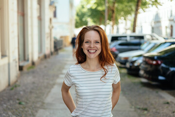 Happy friendly young woman with a vivacious smile