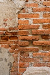 Fototapeta premium The cement walls are old and deteriorated over time. The walls were so cracked that they could see bricks made of clay.