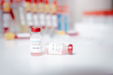 Sample of coronavirus vaccine (COVID-19) on work table in a medical lab.