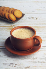 Cup of Tea on wooden table with Butter biscuits