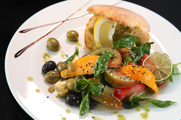 SalaSalad with tomatoes, basil and mozzarella.d with tomatoes, basil and mozzarella.
