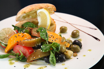 SalaSalad with tomatoes, basil and mozzarella.d with tomatoes, basil and mozzarella.