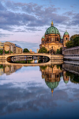 Fototapeta premium The Berlin Cathedral after sunset with a reflection in the river Spree