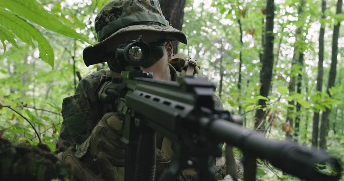 Soldiers or private military contractors aiming with rifle. war, army, weapon, technology and people concept
