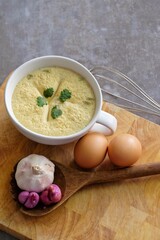 soup with eggs and bread