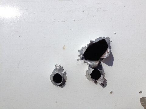 Automobile Shot Up Bullet Gun Fire Fight Holes