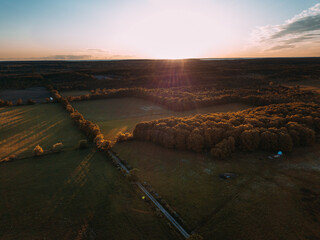 Aerial View of the Sunset over a Farm in the Countryside