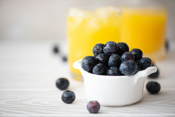 large ripe blueberries with orange juice