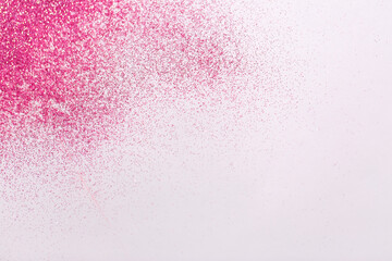 party, decoration and holidays concept - pink glitters on white background