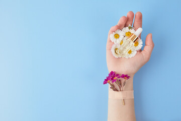 Hand cosmetics with flower, serum and adhesive plasters. Cosmetics for hands anti wrinkle, spa, beauty salon concept