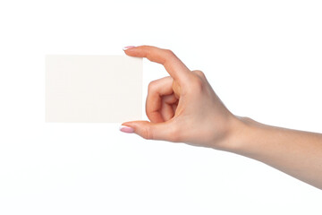 Obraz premium Woman's hand with blank white business card isolated on white