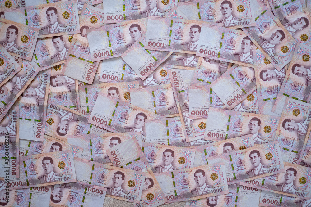 Wall mural thai money background. stacking of a banknote type of thai currency