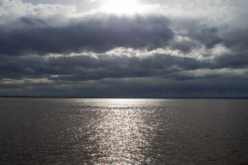 seascape with a view of the coast, horizon and clouds