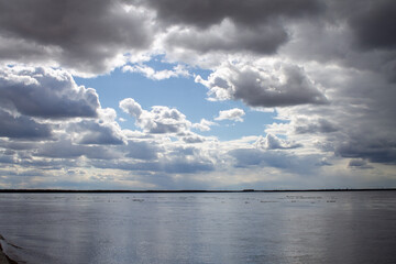 seascape with a view of the coast, horizon and clouds