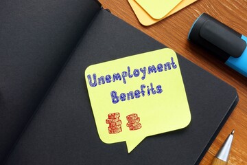 Business concept meaning Unemployment Benefits with inscription on the sheet.