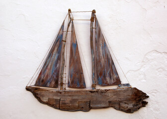Decorative wooden ship hanging on a wall