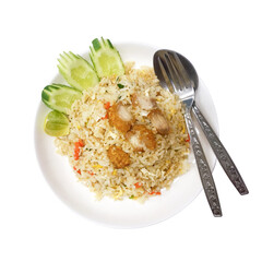 Fried rice with crispy pork served with cucumber and lime on white plate, isolated on white...