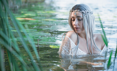 Old European magic, Mystical Pagan scene, woman in lake, rituals. Magic divination in water,...