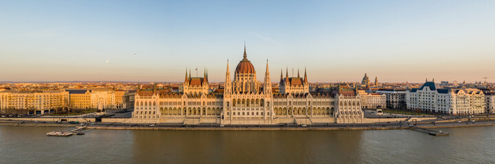 Fototapeta na wymiar Panorama aerial drone shot of Hungarian Parliament facade during Budapest sunset