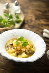 Traditional homemade mushroom soup with fresh parsley