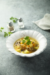 Traditional homemade mushroom soup with fresh parsley