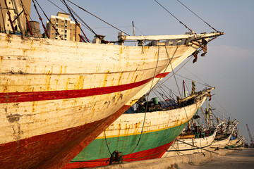 Morning light shines on a group of ships docked at Sunda Kelapa Habour in Jakarta.