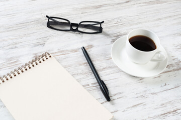 Still life of office workspace with cup of coffee