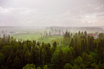 View of the village and forest in the rain