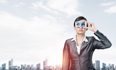 Woman covering her eyes with smartphone