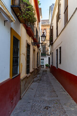 Narrow alley in the Old Town of Seville, Andalucia, Spain.