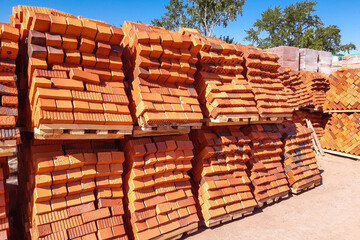 warehouse of production of a brick factory with bricks on pallets
