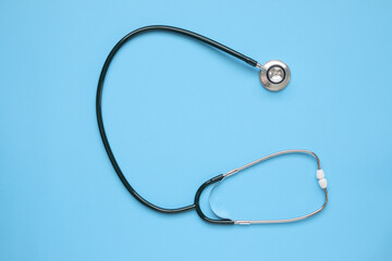 Stethoscope medical equipment on blue background healthcare concept