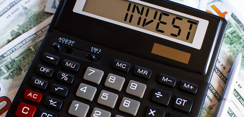 Calculator with the word INVEST on the display