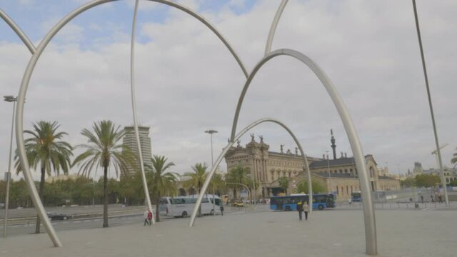 An amazing long tilting down view of Aduana, Customs building at Barcelona harbour, Catalonia, Spain over the fence.
