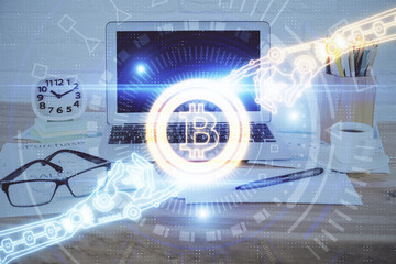 Double exposure of blockchain and crypto economy theme hologram and table with computer background. Concept of bitcoin cryptocurrency.
