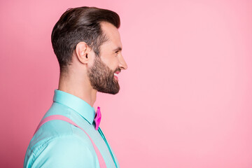 Profile side photo of positive cheerful guy look copyspace listen his friends wear shine outfit isolated over pastel color background