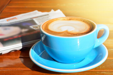 A concept of business breakfast: coffee and news.