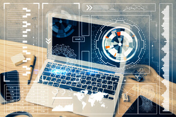 Double exposure of desktop computer and technology theme hologram. Concept of software development.