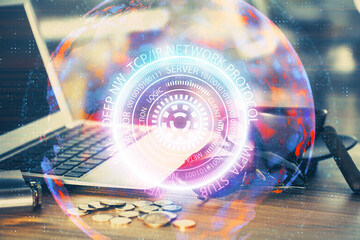 Computer on desktop in office with technology theme hologram. Multi exposure. Tech concept.