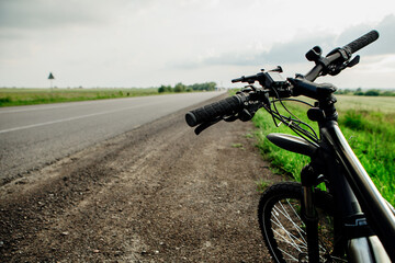 Man with helmet bicycling in traffic