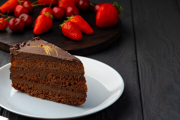 Piece of chocolate cake served with fresh berries