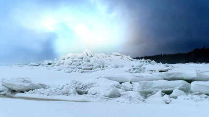 Huge ridge of ice hummocks after a powerful winter storm. Climate and weather change