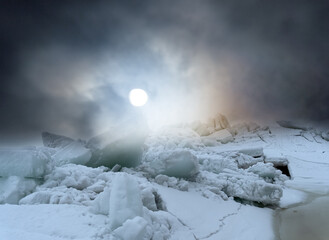 Huge ridge of ice hummocks after a powerful winter storm. Climate and weather change