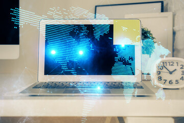 Computer on desktop with social network theme icon. Multi exposure. Concept of international...