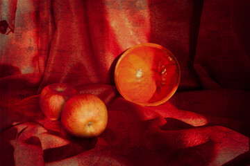 Still life with apples and ceramic bowl in red colors